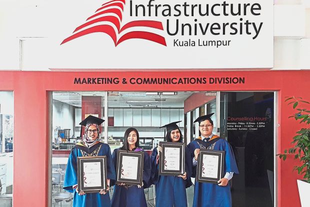 (From left) Fatin Nadhirah and Vice Chancellor’s Award recipients Law, Nurul Najihah and Wong after receiving their scrolls at the 16th IUKL convocation ceremony.